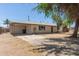 Single-story home featuring a carport and spacious driveway at 716 S Lewis --, Mesa, AZ 85210