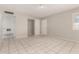 Bright living room with neutral paint, tile floor and multiple doors at 716 S Lewis --, Mesa, AZ 85210