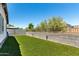 Backyard with artificial grass and block wall fencing for privacy at 7423 S 28Th Pl, Phoenix, AZ 85042