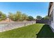 Large backyard area with artificial grass, great for low maintenance and enjoyment at 7423 S 28Th Pl, Phoenix, AZ 85042