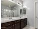 Bathroom with dual sinks, large mirror, and ample counter space at 7423 S 28Th Pl, Phoenix, AZ 85042