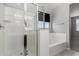 Bright bathroom featuring a soaking tub and a glass-enclosed shower at 7423 S 28Th Pl, Phoenix, AZ 85042