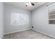 Bedroom featuring a window and an accent wall at 7423 S 28Th Pl, Phoenix, AZ 85042