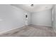 Spacious bedroom with neutral carpet, light gray walls, and an abundance of natural light at 7423 S 28Th Pl, Phoenix, AZ 85042
