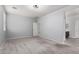 Large bedroom with plush carpet and an open doorway to the bathroom at 7423 S 28Th Pl, Phoenix, AZ 85042
