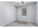 Cozy bedroom with carpet, a window, and modern ceiling fan at 7423 S 28Th Pl, Phoenix, AZ 85042
