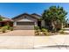Charming single-story home with a well-manicured front yard and an attached two-car garage at 7423 S 28Th Pl, Phoenix, AZ 85042