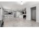 Spacious open floor plan with modern tile flooring, connecting living and kitchen areas at 7423 S 28Th Pl, Phoenix, AZ 85042