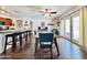 Bright dining area featuring a modern table set, open layout, and access to outdoor living space at 8343 E Edward Ave, Scottsdale, AZ 85250