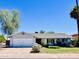Inviting single-story home with a well-maintained lawn and mature trees at 8343 E Edward Ave, Scottsdale, AZ 85250