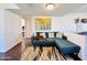 Inviting living room showcasing a comfortable blue sectional sofa and stylish decor at 8343 E Edward Ave, Scottsdale, AZ 85250