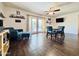 Comfortable living area featuring stylish seating, a ceiling fan, and sliding glass doors to the backyard at 8343 E Edward Ave, Scottsdale, AZ 85250