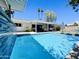 Beautiful pool and patio area with covered seating, ideal for enjoying sunny days and entertaining guests at 8343 E Edward Ave, Scottsdale, AZ 85250