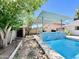 Inviting pool area with a shaded bar area, perfect for relaxation and outdoor dining at 8343 E Edward Ave, Scottsdale, AZ 85250