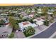 Scenic aerial view of a neighborhood highlighting the home's lush landscaping and proximity to the mountains at 8618 E Via De Encanto --, Scottsdale, AZ 85258