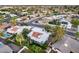 Aerial view showcasing a neighborhood with mature trees, a nearby pool, and easy access to roads at 8618 E Via De Encanto --, Scottsdale, AZ 85258