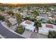 Scenic aerial view of a neighborhood highlighting the home's lush landscaping and mature trees at 8618 E Via De Encanto --, Scottsdale, AZ 85258
