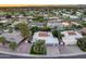 Aerial view of a home with a tile roof, well-manicured lawn, and mature trees at 8618 E Via De Encanto --, Scottsdale, AZ 85258