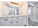 Bathroom featuring marble countertops, a large mirror, and decorative lighting fixtures at 8618 E Via De Encanto --, Scottsdale, AZ 85258