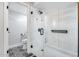 Walk-in shower featuring glass enclosure, rainfall shower head, and marble tile surround at 8618 E Via De Encanto --, Scottsdale, AZ 85258