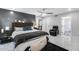 Bedroom featuring a ceiling fan, accent wall, and doorway access to the home's hallway at 8618 E Via De Encanto --, Scottsdale, AZ 85258