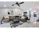 Spacious living room with a modern sectional, bar area, and a stylish barn door, enhanced by marble flooring at 8618 E Via De Encanto --, Scottsdale, AZ 85258