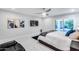 Modern bedroom boasts natural light, backyard access, and a mounted TV at 8618 E Via De Encanto --, Scottsdale, AZ 85258