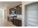 Well-equipped kitchen featuring stainless steel appliances and ample cabinet space with granite counters at 9155 W Minnezona Ave, Phoenix, AZ 85037