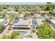 Aerial view of home with swimming pool, desert landscaping, solar panels and tile roof at 9421 E Calle De Valle Dr, Scottsdale, AZ 85255