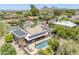 Aerial view of home with solar panels, outdoor kitchen, and private pool at 9421 E Calle De Valle Dr, Scottsdale, AZ 85255