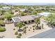 Aerial view of home with desert landscaping, solar panels, tile roof and private courtyard at 9421 E Calle De Valle Dr, Scottsdale, AZ 85255