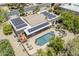 Aerial view of home with swimming pool, desert landscaping, solar panels, tile roof and outdoor kitchen at 9421 E Calle De Valle Dr, Scottsdale, AZ 85255
