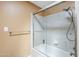 Bright bathroom showcasing a shower stall with glass door, chrome fixtures and showerhead, with neutral tiled surround at 9421 E Calle De Valle Dr, Scottsdale, AZ 85255