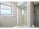 Modern bathroom featuring a glass-enclosed shower and sleek fixtures at 9421 E Calle De Valle Dr, Scottsdale, AZ 85255