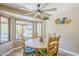 Cozy dining area with a wooden table, comfortable seating, and a large window view at 9421 E Calle De Valle Dr, Scottsdale, AZ 85255