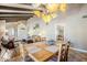 Stylish dining area open to the living space, featuring a wooden table and decorative lighting at 9421 E Calle De Valle Dr, Scottsdale, AZ 85255
