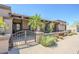 Charming home with decorative iron gate, desert landscaping, and a tile roof at 9421 E Calle De Valle Dr, Scottsdale, AZ 85255