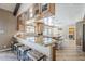Spacious kitchen with a breakfast bar, granite countertops, and custom wood cabinets at 9421 E Calle De Valle Dr, Scottsdale, AZ 85255