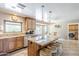 Bright kitchen with a center island, breakfast nook, and modern appliances at 9421 E Calle De Valle Dr, Scottsdale, AZ 85255