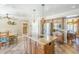 Kitchen featuring a center island, stainless steel appliances, and an adjacent dining area at 9421 E Calle De Valle Dr, Scottsdale, AZ 85255