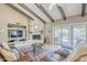 Inviting living room featuring a vaulted ceiling, fireplace and cozy seating at 9421 E Calle De Valle Dr, Scottsdale, AZ 85255