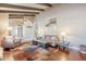 Bright living room with an open floor plan, wood floors, and a comfortable seating area at 9421 E Calle De Valle Dr, Scottsdale, AZ 85255
