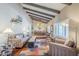 Inviting living room with high ceilings, exposed beams, and stylish furnishings at 9421 E Calle De Valle Dr, Scottsdale, AZ 85255