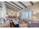 Open-concept living room featuring hardwood floors, a patterned rug, and comfortable seating at 9421 E Calle De Valle Dr, Scottsdale, AZ 85255