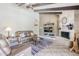 Spacious living room with a fireplace, entertainment center, and stylish decor at 9421 E Calle De Valle Dr, Scottsdale, AZ 85255