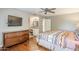 Spacious main bedroom with dresser, vanity area, TV, and ensuite bathroom access at 9421 E Calle De Valle Dr, Scottsdale, AZ 85255