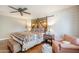 Stylishly furnished main bedroom featuring barn doors, accent chair, and rustic touches at 9421 E Calle De Valle Dr, Scottsdale, AZ 85255
