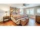 Warm and inviting main bedroom with sliding barn doors, wood accents, and stylish decor at 9421 E Calle De Valle Dr, Scottsdale, AZ 85255