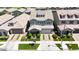 An eye-level aerial of a two-story home with manicured landscaping, a driveway, and a two-car garage at 10036 E Naranja Ave, Mesa, AZ 85209