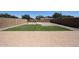 Spacious backyard featuring artificial grass, a playground, and pavers at 10036 E Naranja Ave, Mesa, AZ 85209
